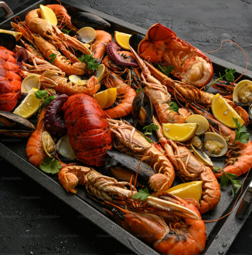 Get the best seafood platter in Kampala with The Royal Boil! Includes 8 shrimp, 1 crab, 1 whole lobster, 4 hard-boiled eggs, 4 large potatoes, 6 sweetcorn pieces, and lemon slices. Feeds 2. Order the freshest seafood in Uganda now!